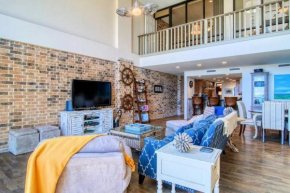 Floor to Ceiling Arched Window Panoramic View of the Coast in This Split Level Penthouse
